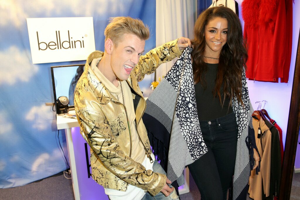 Singer Aaron Carter (L) and dancer Lee Karis with Belldine at the GRAMMY Gift Lounge during The 58th GRAMMY Awards at Staples Center on February 13, 2016 in Los Angeles, California. (Photo by Imeh Akpanudosen/WireImage)